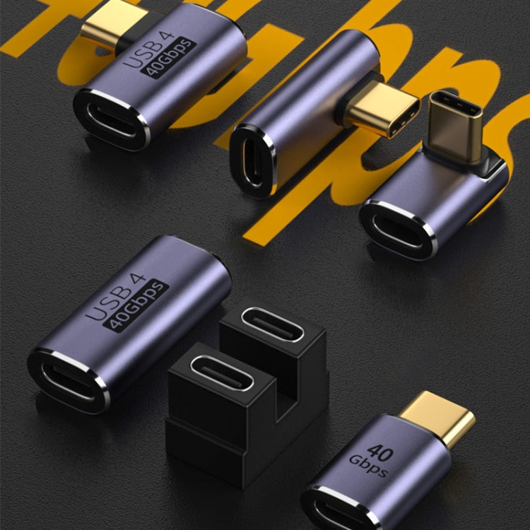 Multiple USB-C elbow adapters with metallic purple metal housings and USB-C ports