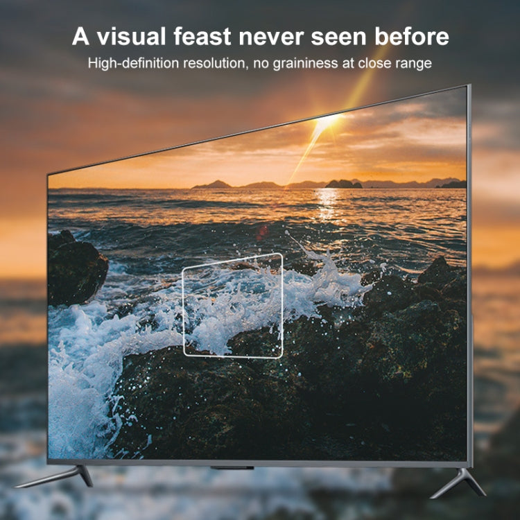 Flat-screen TV displaying coastal ocean scene with overlay graphic