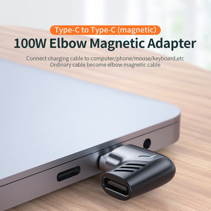 Black USB-C elbow magnetic charging adapter plugged into a laptop port
