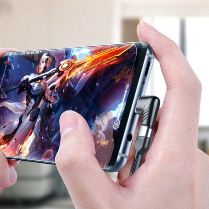 Magnetic USB-C elbow adapter plugged into a phone port