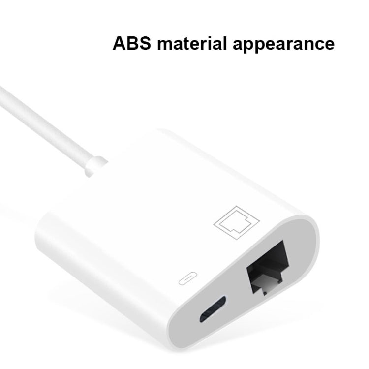 USB-C to Ethernet adapter close-up showing RJ45 port and small status button