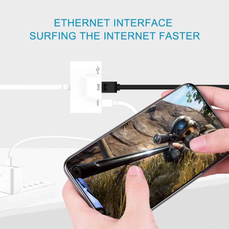 White RJ45 Ethernet adapter with USB-C connector connected to a smartphone