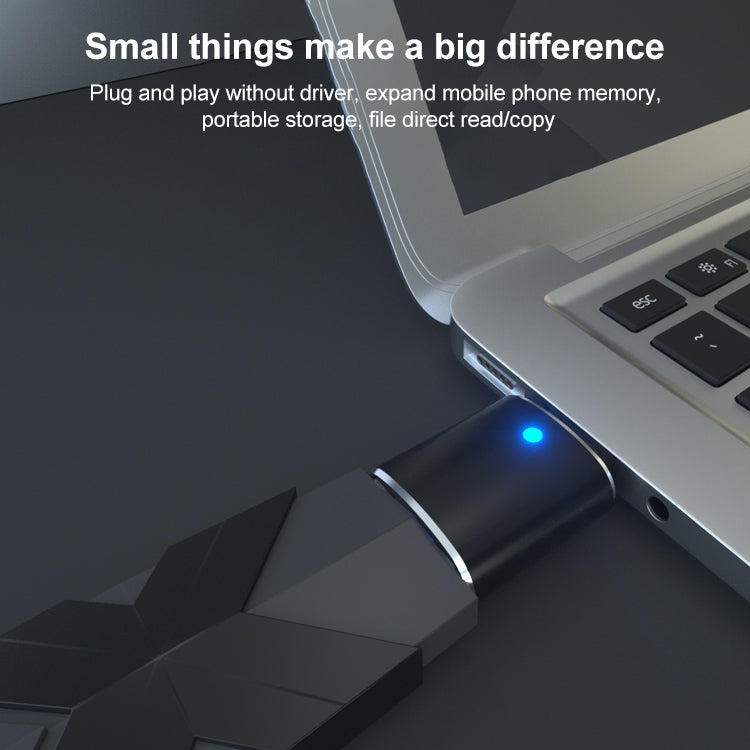 Black USB to Type-C OTG flash driver with blue status light and attached Type-C plug