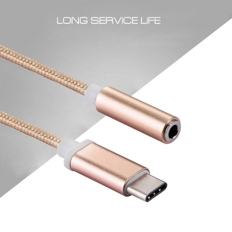 Rose gold USB-C to 3.5mm audio adapter with braided cord and 3.5mm jack