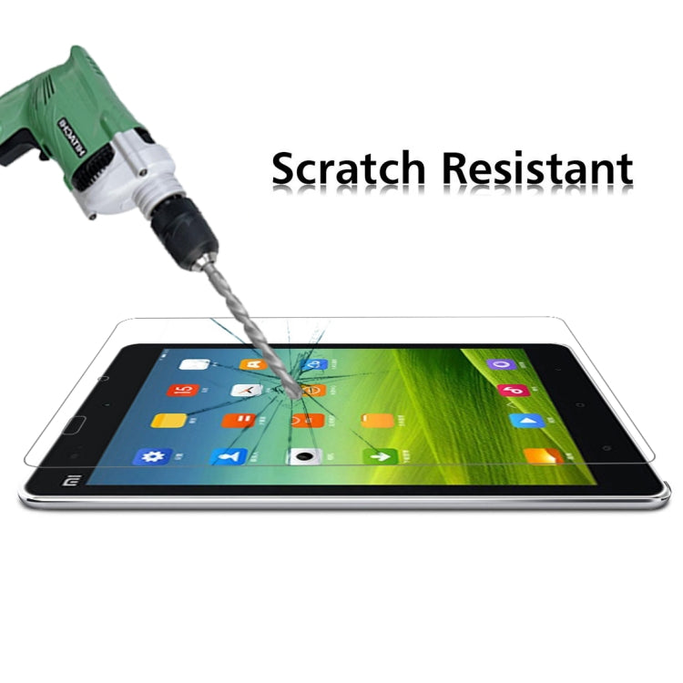 Tempered glass screen protector film on tablet, drill impact on protected screen