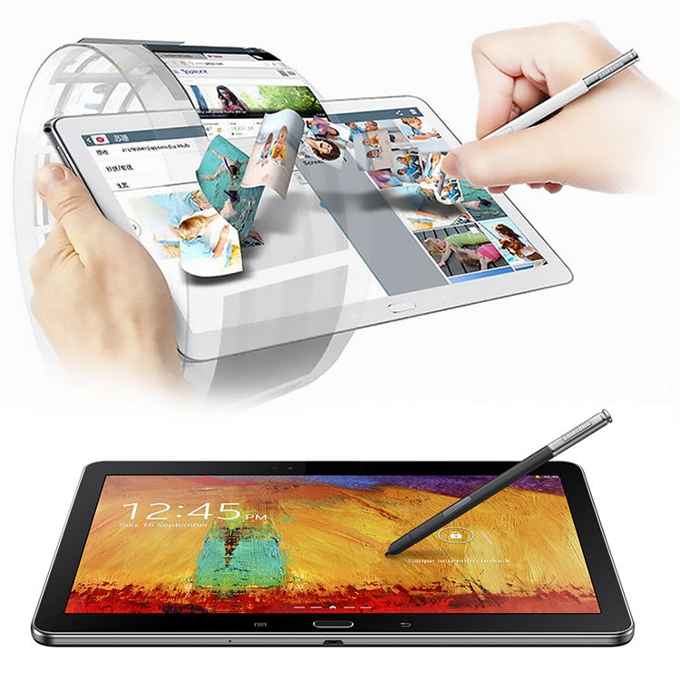 Silver-and-black stylus pen used on tablet screen, held by hand