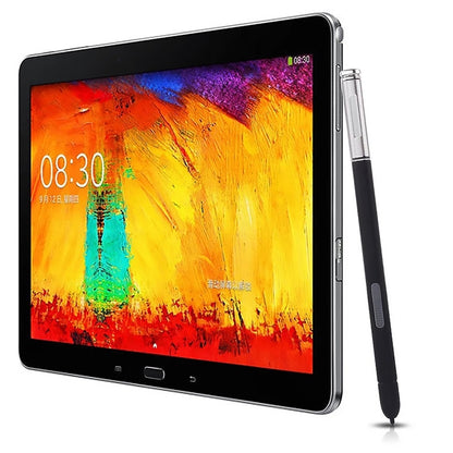 Black stylus pen next to tablet with colorful display