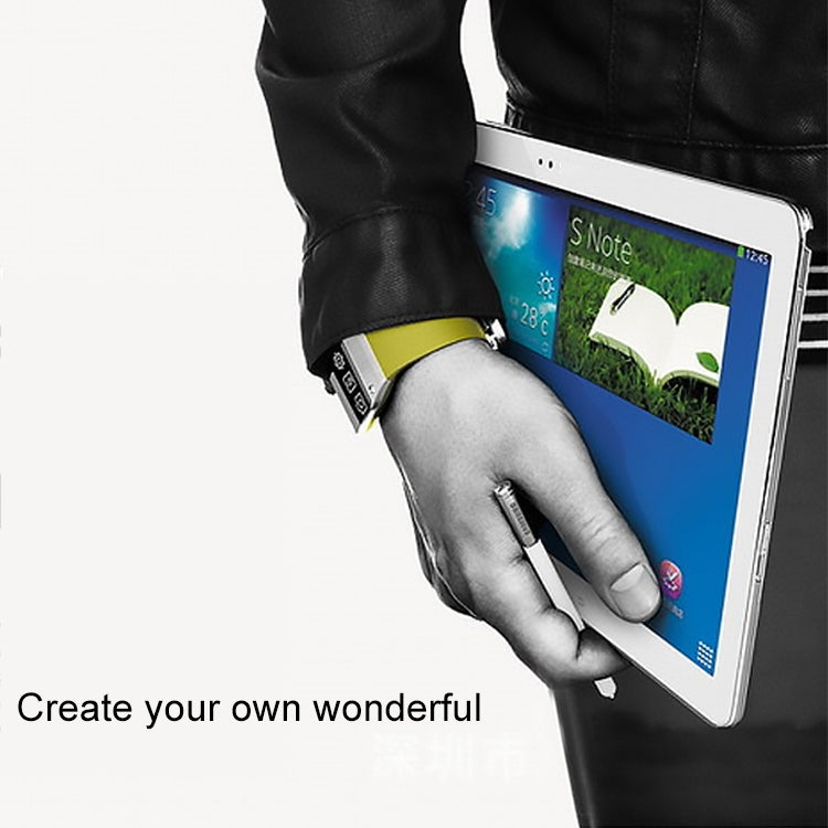 Black stylus pen held in hand over tablet screen