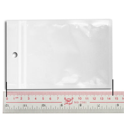 Clear zip-lock plastic poly bag with hanging hole, measured against a ruler.