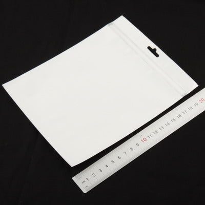 White anti-static zip lock bag with seal, laid flat and measured with a ruler