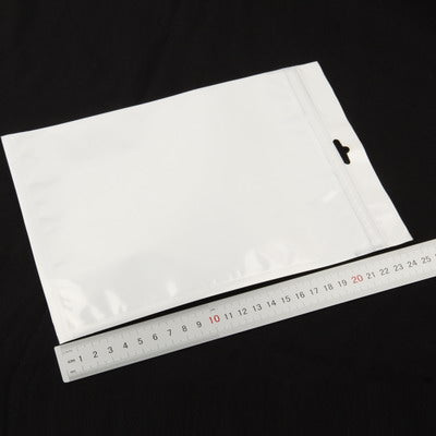 White anti-static zip-lock bag with ruler scale, flat lay