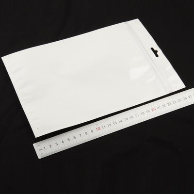 Anti-static zip lock bag with tear notch, flat sealed, shown with ruler scale