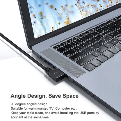 Angle USB-C to USB 3.0 adapter cable connected to laptop USB port, saves space