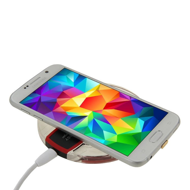 Qi wireless charging receiver module for Galaxy Note Edge, angled with circular charging base