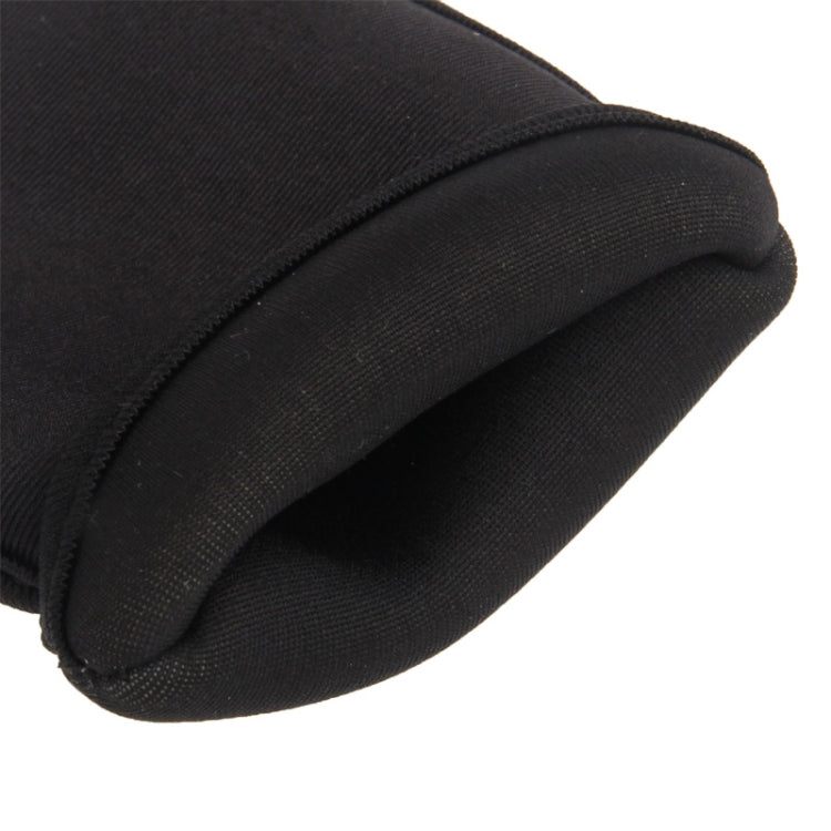 Black fabric sleeve close-up with textured material and rounded seam edge