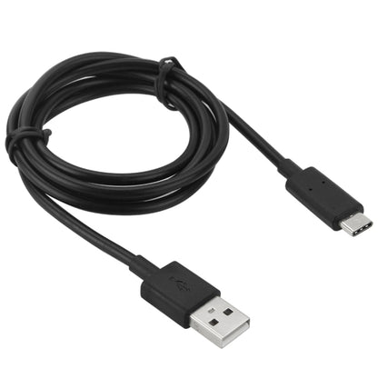Coiled black USB-A to USB Type-C cable with molded plugs