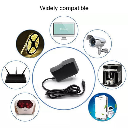 Black AC travel charger with DC barrel plug and power cord
