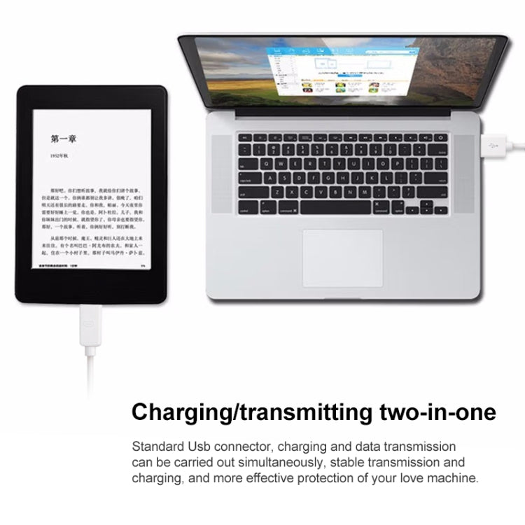 White micro USB cable connected for charging and data to a laptop