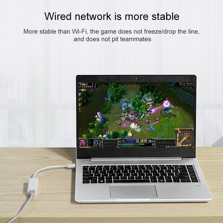 USB Ethernet adapter connected to a laptop for wired network