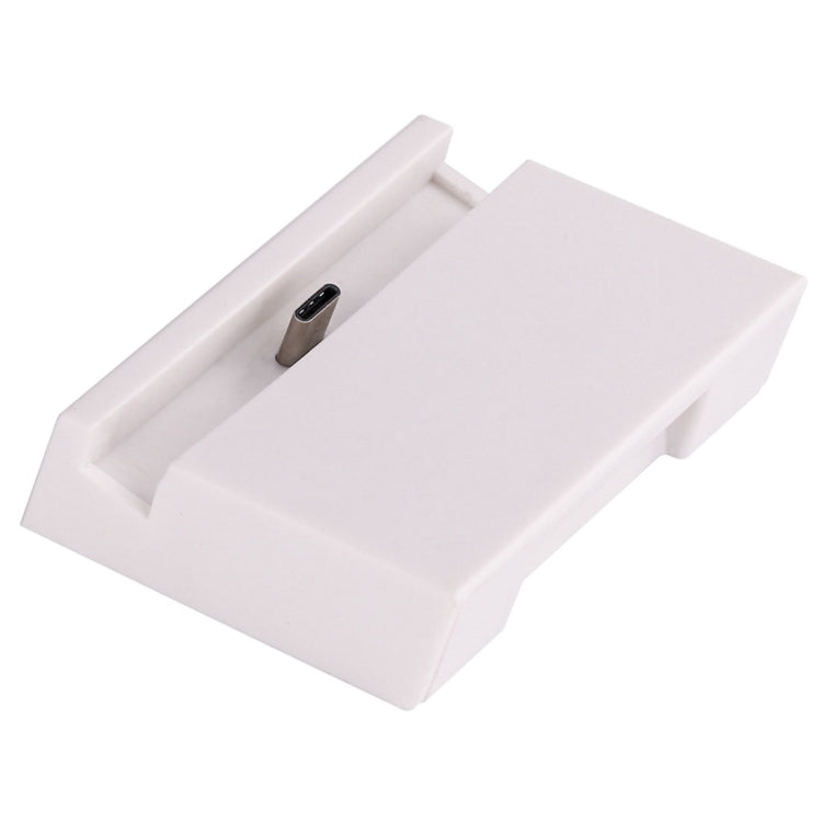 White USB-C dock stand with recessed charging port on support