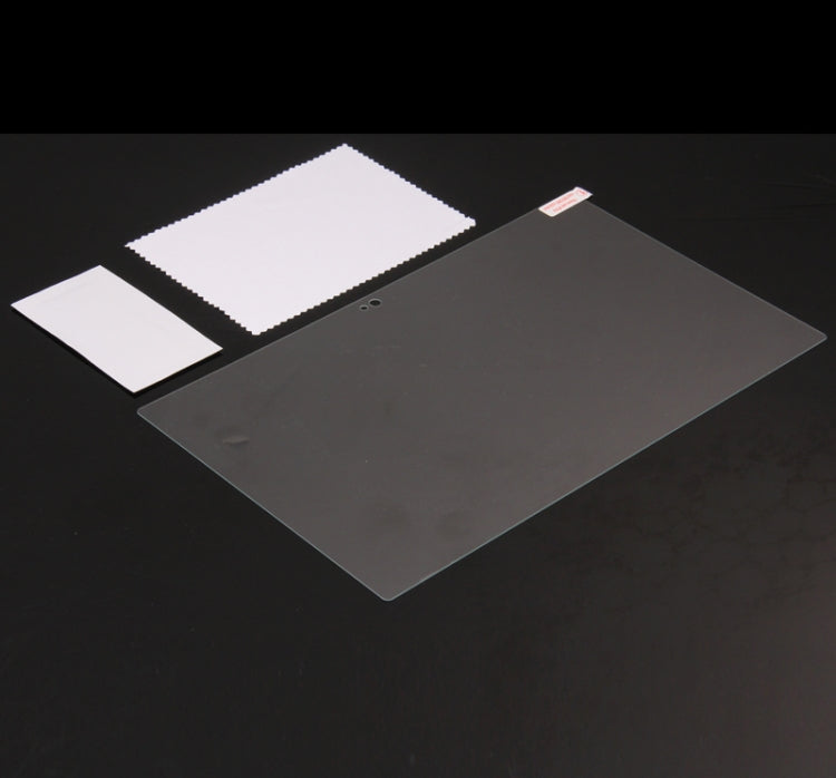 Tempered glass screen protector film pieces with alignment tabs on dark surface