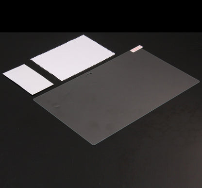 Tempered glass screen protector film pieces with alignment tabs on dark surface