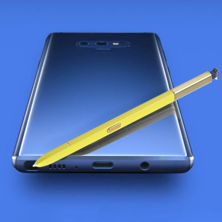 Yellow stylus pen resting alongside Galaxy Note9 phone