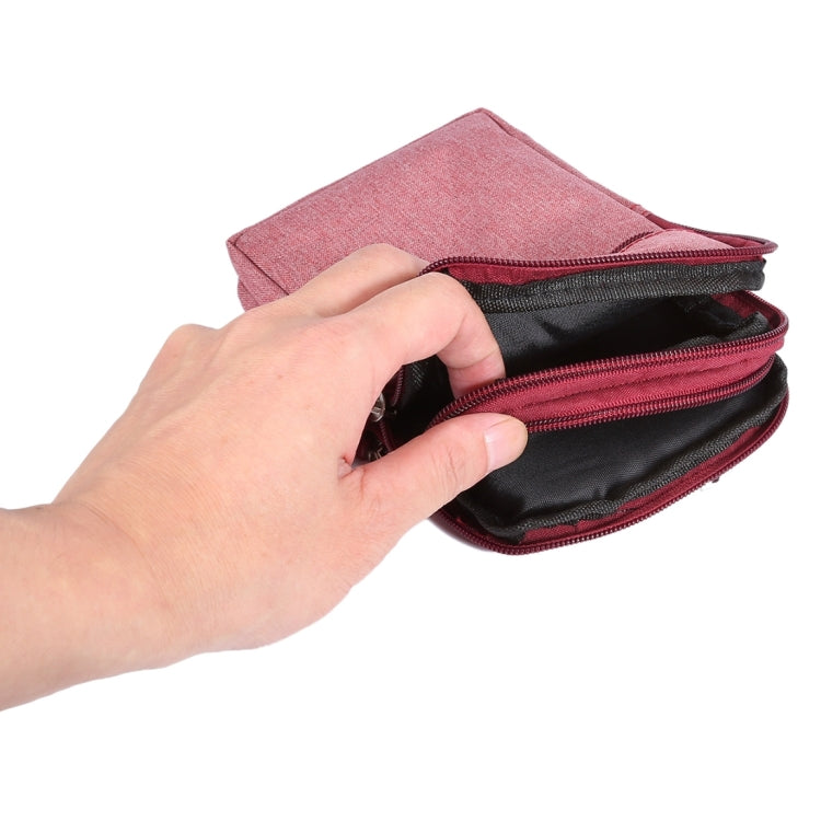 Pink fabric smartphone waist bag opened to show inner lining and dual zip compartments