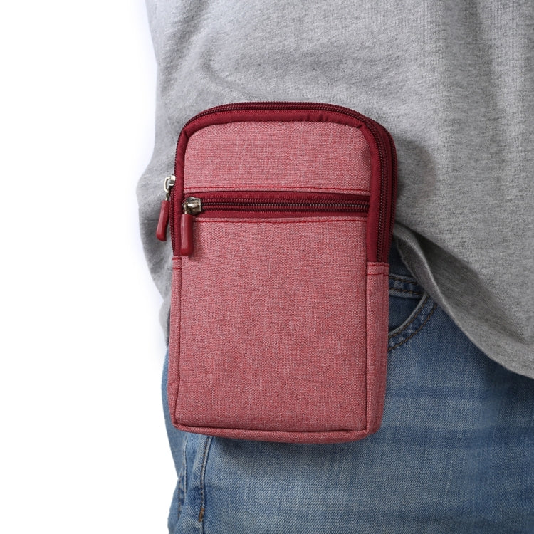 Pink fabric crossbody waist bag with front zip pocket and metal zipper pulls