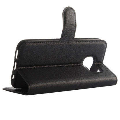 Black textured leather flip case with kickstand and cutout for camera access