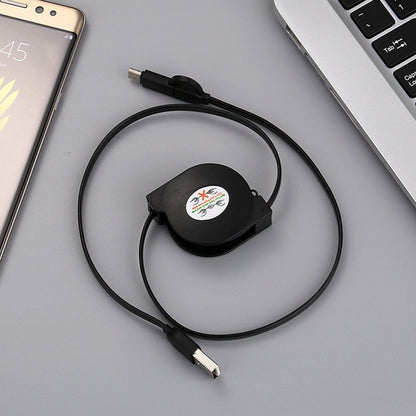 Black retractable USB charging cable with coiled cord and USB-A connector