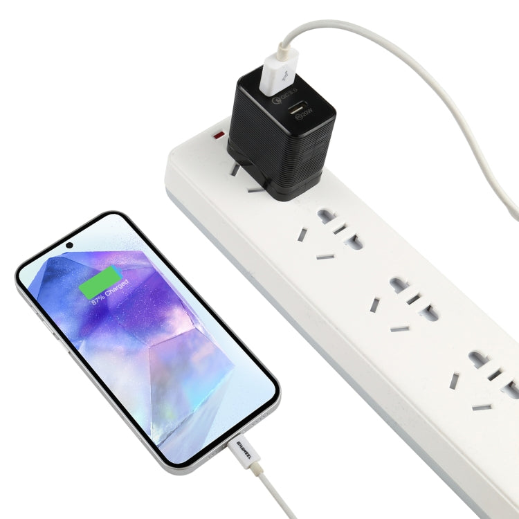 Black USB-C PD travel charger with dual ports, connected with power cable