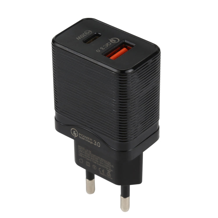 Black EU plug travel charger with ribbed body and orange USB port