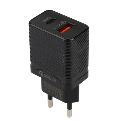 Black EU plug travel charger with ribbed body and orange USB port