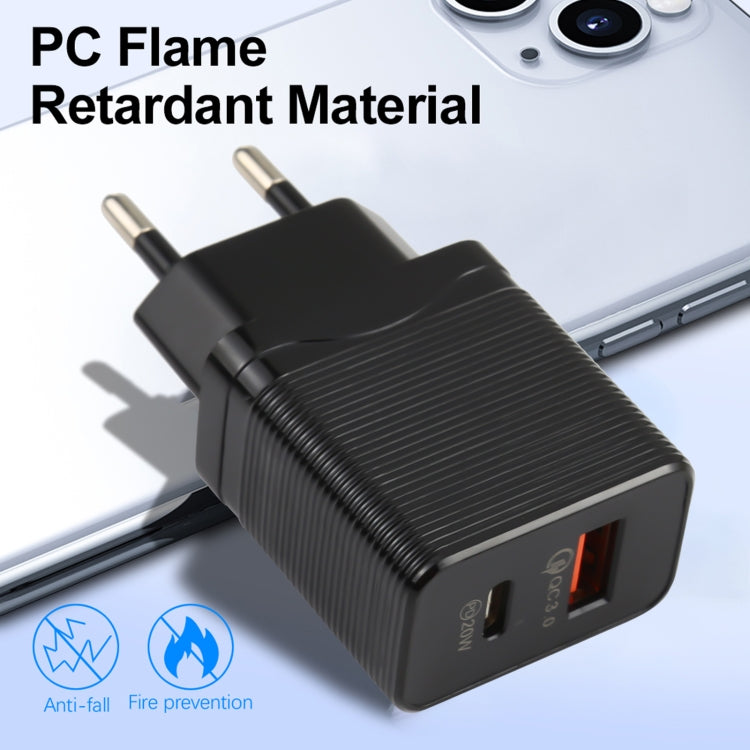 Black EU wall charger with ribbed texture and dual USB ports on the front