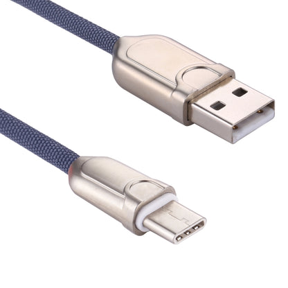 Blue braided USB-A to USB-C cable with metal USB-A and USB-C ends close-up