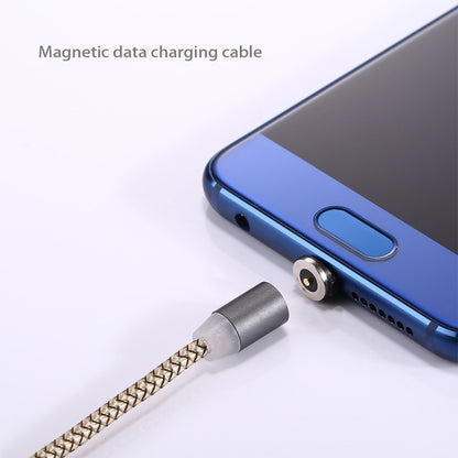 Micro USB magnetic cable tip connected to charging port on a blue phone, grey braid.