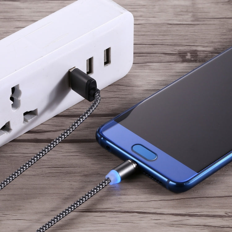 Magnetic USB-C charging cable connecting phone to USB wall charger, braided black cord
