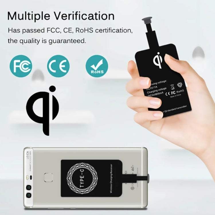 Black Type-C wireless charging receiver in hand with certification icons displayed