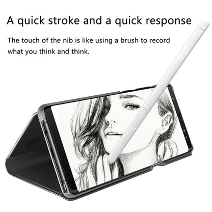 White touch stylus pen held above tablet screen with grayscale drawing