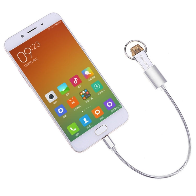 Silver OTG adapter cable plugged into a smartphone via Type-C connector