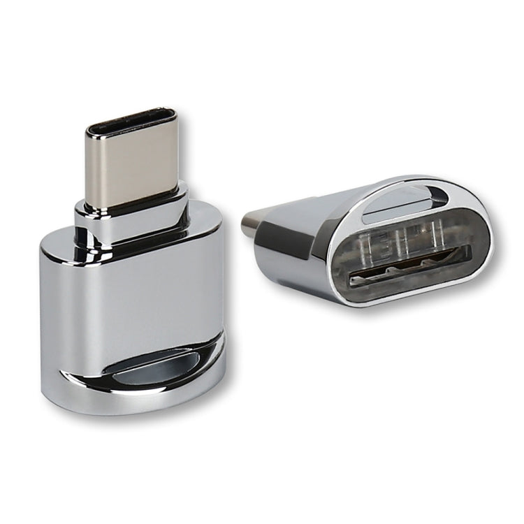 Silver USB-C to TF card reader adapter with exposed card slot and metal body