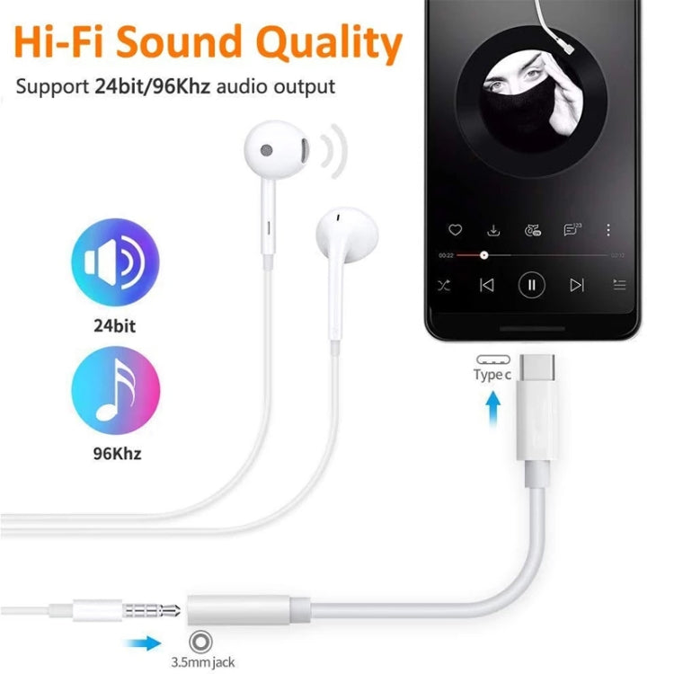 White audio adapter cable connecting USB-C to 3.5mm headphone jack