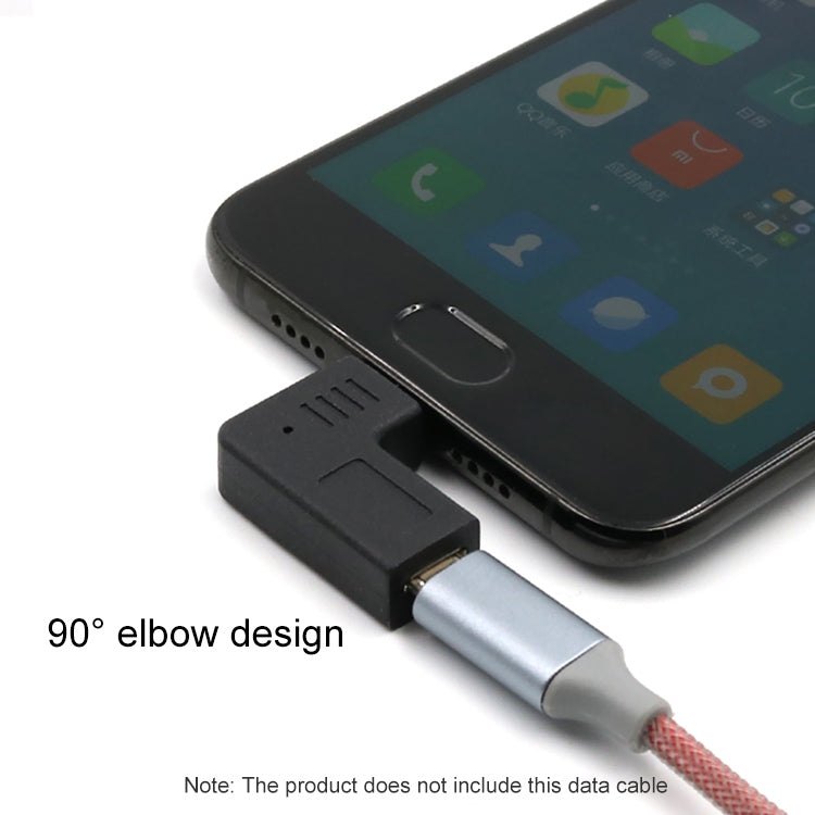 Angled black USB adapter attached to a phone charging port with gray cable end