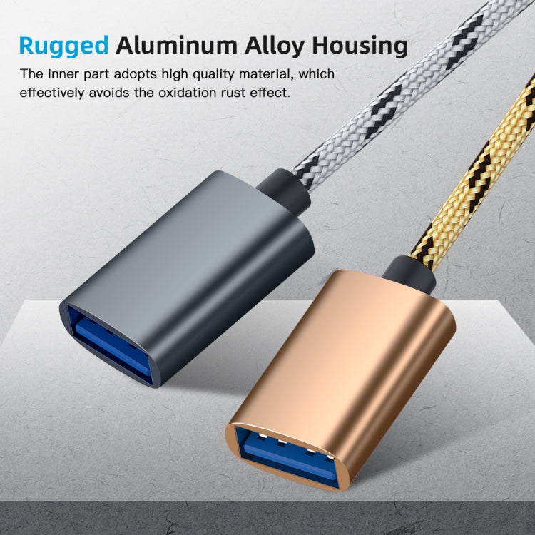 Nylon braided adapter cable with grey and gold housings, USB-C and Micro USB connectors