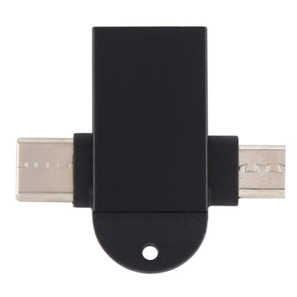 Black USB OTG adapter with sling hole, showing USB-C and micro USB ends