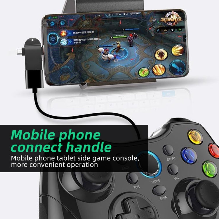 Black OTG adapter connected to a phone, with USB-C and USB-A connector ends