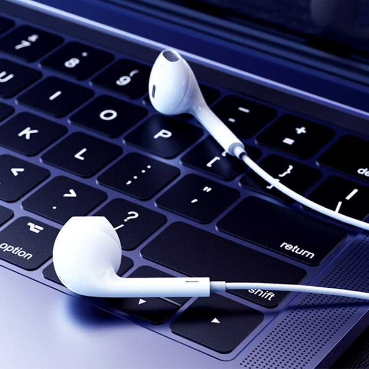 White wired in-ear headphones with USB-C plug, earbud tips and long connecting cable