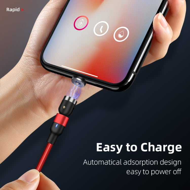 Red braided magnetic charging cable with USB-C plug held near a phone charging port.