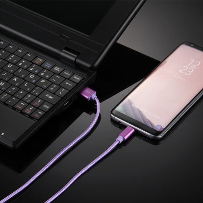 Purple braided USB to USB-C charging cable connected to a smartphone